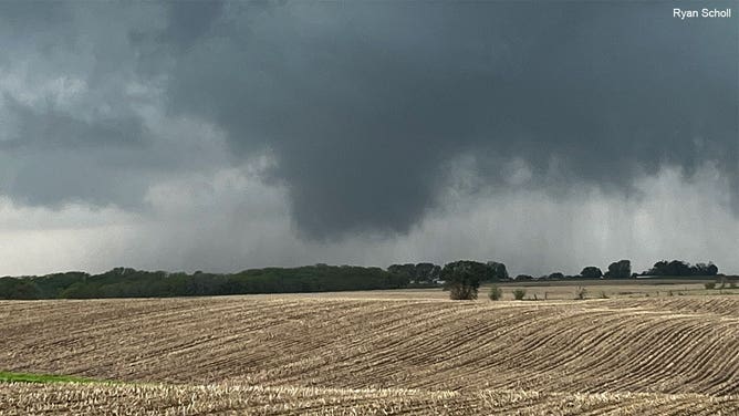 A funnel cloud hovers over the countryside near Pleasantville, Iowa, on May 13, 2023.