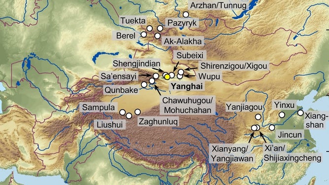 Map showing the location of the Yanghai cemetery site (yellow dot) near modern Turfan in Northwest China and other sites referred to in the study (white dots).