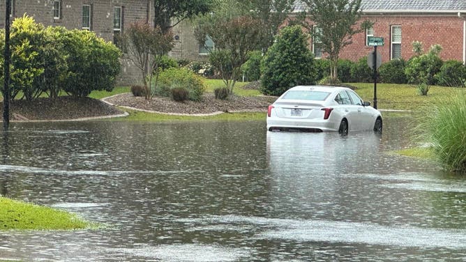 Car surrounded by floodwater on Friday, May 19, 2023.