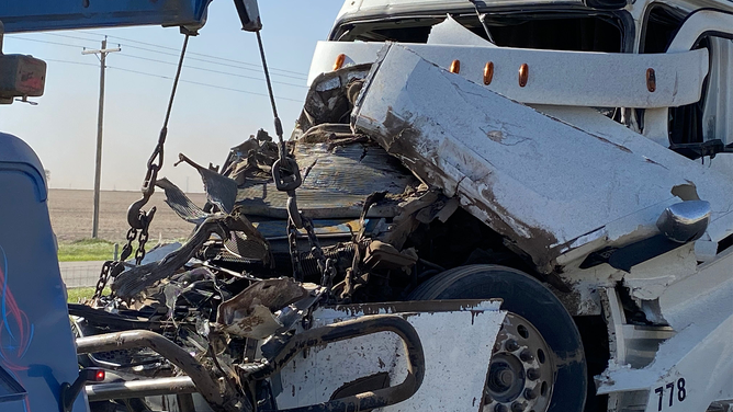 A damaged tractor-trailer is seen after a massive pileup caused by a dust storm on I-55 in Illinois on Monday, May 1, 2023.