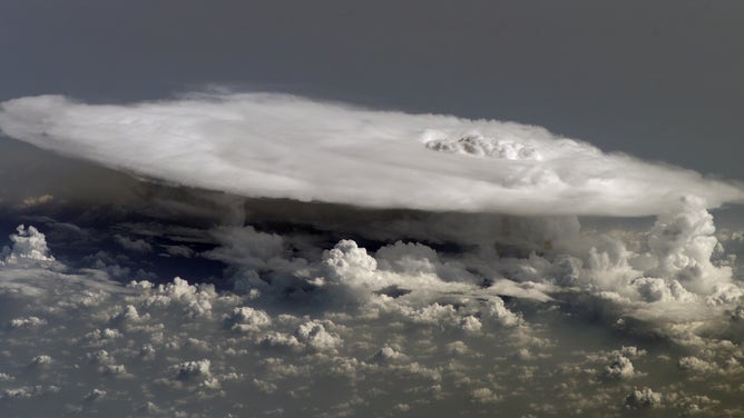 A new NASA mission, PolSIR, short for Polarized Submillimeter Ice-cloud Radiometer, will study high-altitude ice clouds, such as this cloud as seen from the International Space Station in 2008. Understanding how such clouds change throughout the day is crucial for improving global climate models.