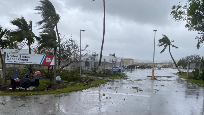 The gate of U.S. Coast Guard Forces Micronesia Sector Guam as seen after clearing debris and U.S. Coast Guard crews in Guam begin assessments and reconstitution efforts on May 25, 2023, after Typhoon Mawar devastated the island. Crews are working to resume operations and reopen the ports.