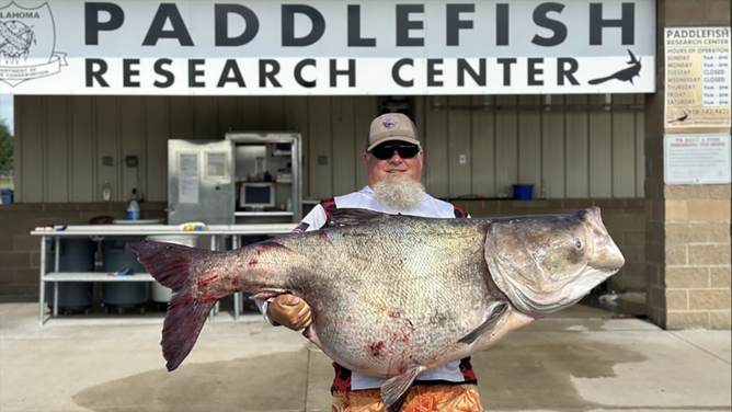 Oklahoma man sets state record with massive bighead carp