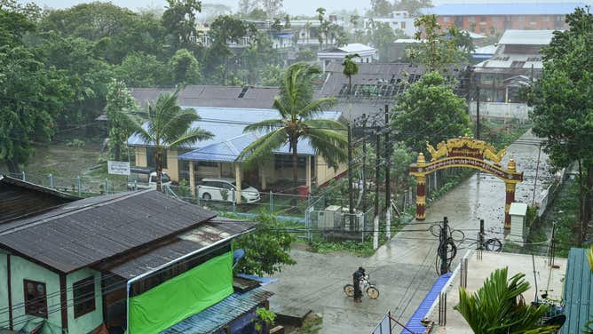 This picture shows a view of a street in Kyauktaw in Myanmar's Rakhine state on May 14, 2023, as Cyclone Mocha's crashes ashore. Cyclone Mocha crashed ashore in Myanmar and southeastern Bangladesh on May 14, 2023, uprooting trees, scattering flimsy homes in Rohingya displacement camps and bringing a storm surge into low-lying areas.