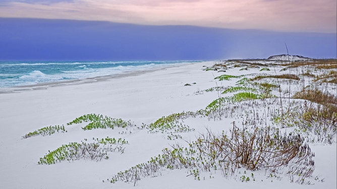 White quartz sand dunes at sunset along the Gulf of Mexico at Gulf Islands National Seashore in winter