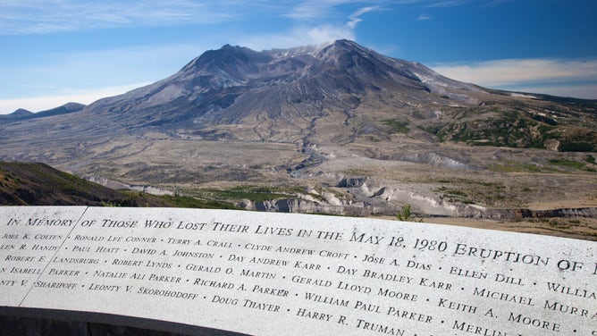 Memorial to lives lost on May 18, 1980 with Mt. St. Helens in the background. Johnston Ridge Observatory, Washington.