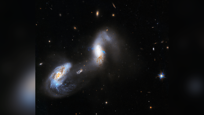 A new image from NASA’s Hubble Space Telescope shows interacting galaxies known as AM 1214-255.