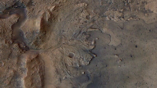 This image shows the remains of an ancient delta in Mars' Jezero Crater, which NASA's Perseverance Mars rover will explore for signs of fossilized microbial life. The image was taken by the High Resolution Stereo Camera aboard the ESA (European Space Agency) Mars Express orbiter. The European Space Operations Centre in Darmstadt, Germany, operates the ESA mission. The High Resolution Stereo Camera was developed by a group with leadership at the Freie Universitat Berlin.