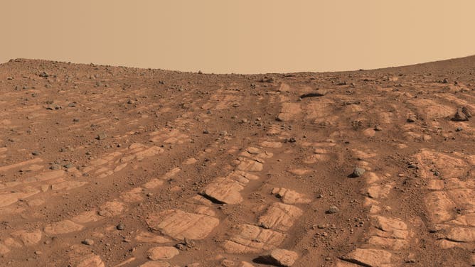 Scientists think that the bands of rocks seen in this image may have been formed by a very fast, deep river – the first of its kind evidence has been found for on Mars. NASA’s Perseverance Mars rover captured this mosaic at a location nicknamed
