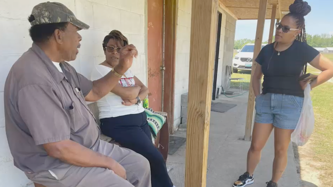 Martin speaks to customers.