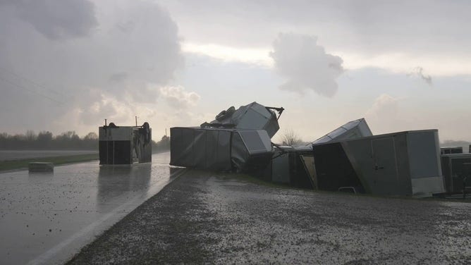 Farm equipment is seen scattered across a road in Grinnell, Iowa, on Sunday, May 7, 2023.