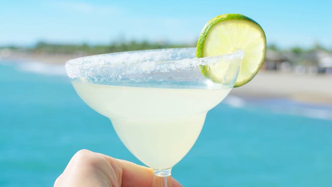 Margarita with a beach in the background.