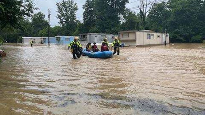 People are rescued from their flooded homes in Kannapolis, North Carolina, on June 20, 2023.
