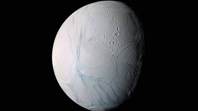 During a 2005 flyby, NASA’s Cassini spacecraft took high-resolution images of Enceladus that were combined into this mosaic, which shows the long fissures at the moon’s south pole that allow water from the subsurface ocean to escape into space.
