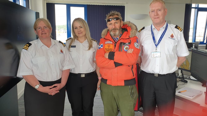 Man's world record endeavor on remote island comes to halt as bad weather forces rescue