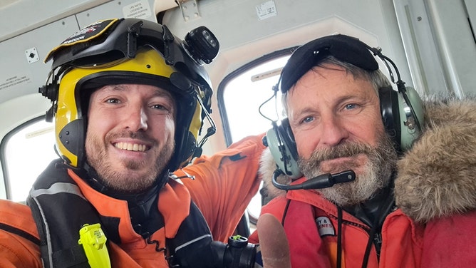 Man's world record endeavor on remote island comes to halt as bad weather forces rescue