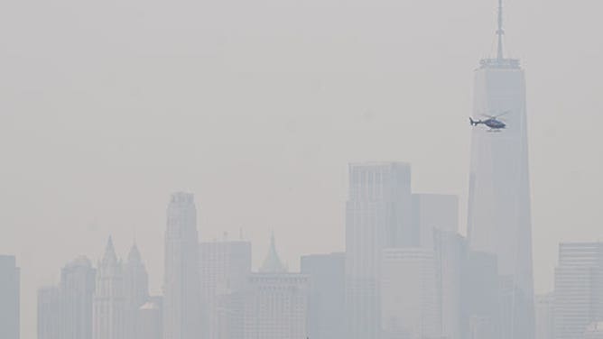 A view of orange haze illuminated the skies across the East on Tuesday morning as wildfire smoke from Canada spread across the East in New York, United States on June 6, 2023.
