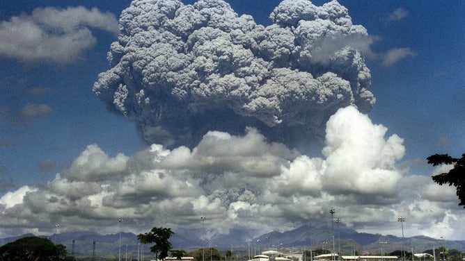A giant volcanic mushroom cloud explodes from Mount Pinatubo on June 12, 1991, followed by another more powerful explosion on June 15, 1991.