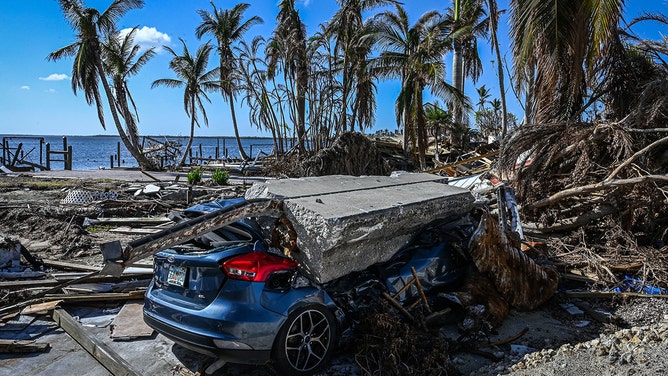 A wrecked car is seen on Matlacha Island in Lee County, Florida, in the aftermath of Hurricane Ian, on November 7, 2022.