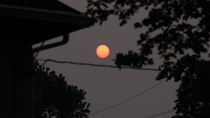 FILE - A view of the sun which was turned red due to the fire fumes in the atmosphere, on June 06, 2023 in New York, United States. The USA was affected by the smoke from the forest fires in Canada.