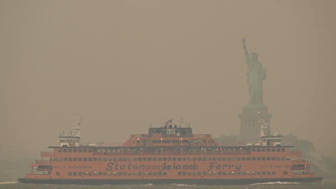 Canadian wildfire smoke creates unhealthy air quality in NYC NEW YORK, US - JUNE 06: The Downtown Manhattan skyline stands shrouded in a reddish haze as a result of Canadian wildfires on June 06, 2023 in New York City. Over 100 wildfires are burning in the Canadian province of Nova Scotia and Quebec resulting in air quality health alerts for the Adirondacks, Eastern Lake Ontario, Central New York and Western New York. (Photo by Lokman Vural Elibol/Anadolu Agency via Getty Images)
