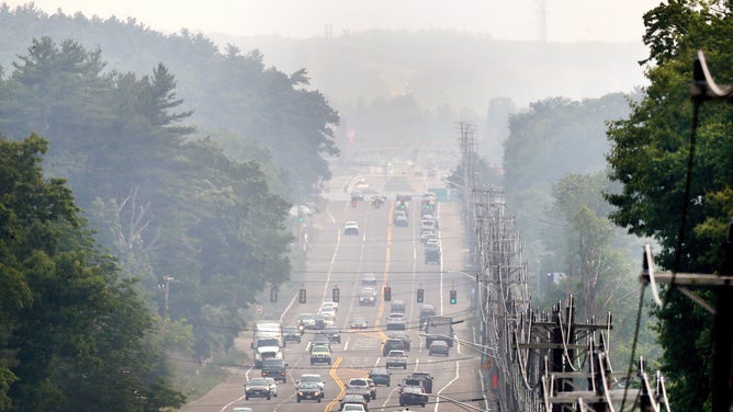 Wrentham, MA - June 6: Smoke from wildfires in Nova Scotia shrouds Washington Street (Route 1 South). (Photo by John Tlumacki/The Boston Globe via Getty Images)