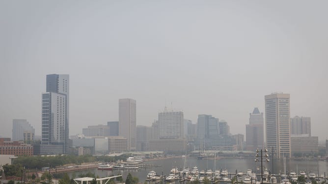 Buildings shrouded in smoke from Canada wildfires in Baltimore, Maryland, US, on Thursday, June 8, 2023. The US Northeast will continue to breathe in choking smoke from fires across eastern Canada for the next few days, raising health alarms across impacted areas. Photographer: Ting Shen/Bloomberg via Getty Images