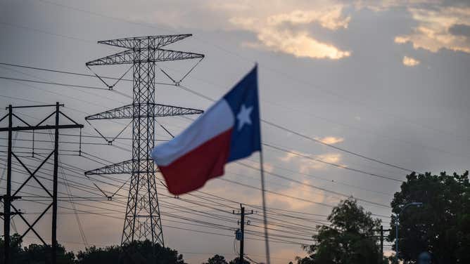 The Electric Reliability Council Of Texas Urges Texans To Lower Their Power Use During Current Heat Wave HOUSTON, TEXAS - JULY 11: A transmission tower is seen on July 11, 2022 in Houston, Texas. ERCOT (Electric Reliability Council of Texas) is urging Texans to voluntarily conserve power today, due to extreme heat potentially causing rolling blackouts. ERCOT has also projected there to be no blackouts this week. (Photo by Brandon Bell/Getty Images)