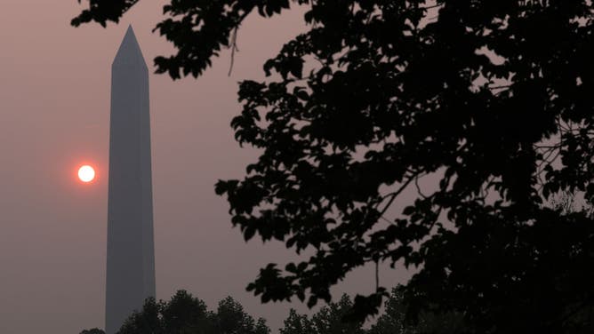 The Washington Memorial stands in hazy smoke on June 8, 2023 in Washington, DC. Air quality alert has been elevated to a Code Purple in Washington due to smoke from wildfires burning in Canada, indicating very unhealthy air conditions for the public.