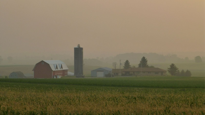 Wildfire smoke turns the sky orange above Hubertus, Wisconsin, on Wednesday, June 29, 2023.