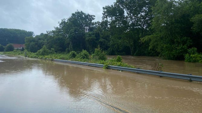 Floodwater crosses a road in Kannapolis, North Carolina, on June 20, 2023.