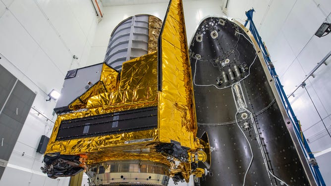 A photo taken on June 27, 2023 shows the last glimpse of ESA’s Euclid space telescope before it was encapsulated by a SpaceX Falcon 9 rocket fairing.
