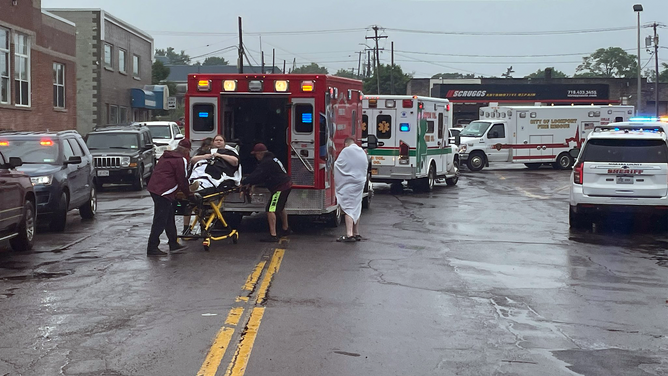 Victims are seen being loaded into an ambulance in Lockport, New York.