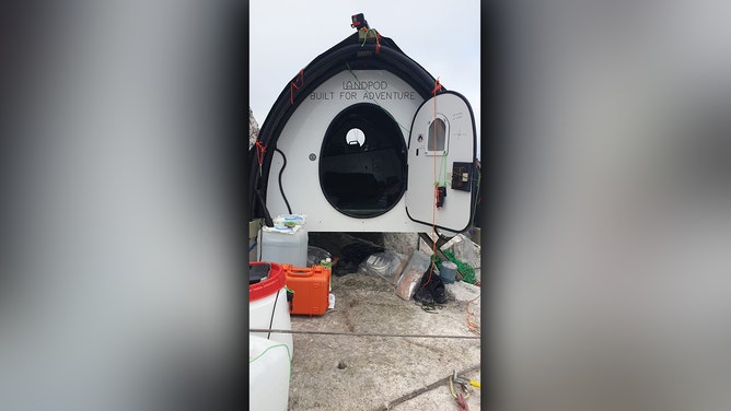 Man's world record endeavor on remote island comes to halt as bad weather forces rescue