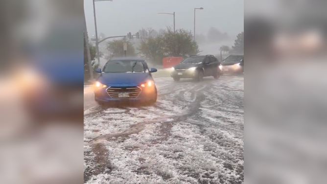 Tiny hail covered the road by a Target parking lot in Lone Tree, Colorado. June 22, 2023.