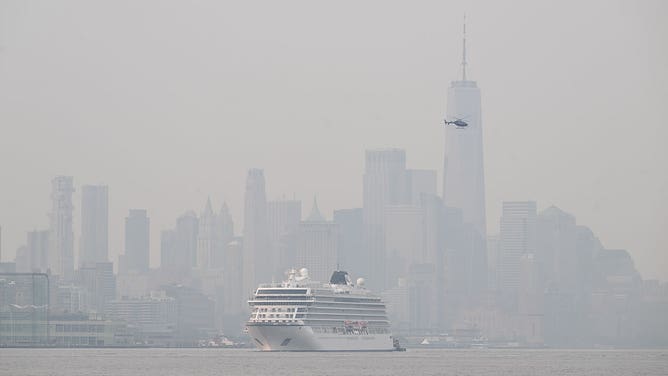 A view of orange haze illuminated the skies across the East on Tuesday morning as wildfire smoke from Canada spread across the East in New York, United States on June 6, 2023.