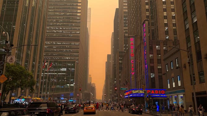 See eerie orange skies over New York City as Canadian wildfire smoke  blankets Northeast