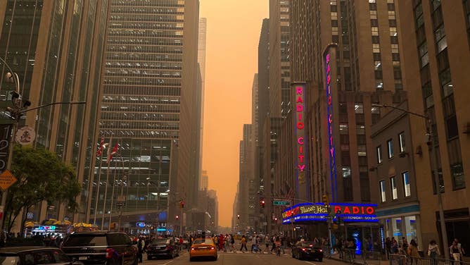 Hazy skies with Radio City Music Hall in the foreground. New York City. June 7, 2023.