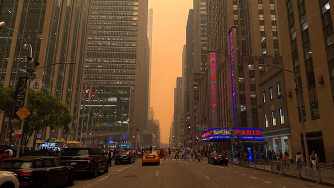 Hazy skies with Radio City Music Hall in the foreground. New York City. June 7, 2023.