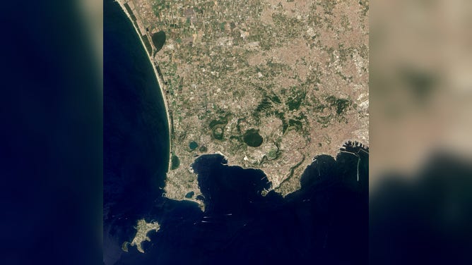 A satellite image shows the Campi Flegrei caldera cluster, the largest volcanic feature along the Bay of Naples, Italy. 