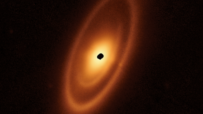 This image of the dusty debris disk surrounding the young star Fomalhaut is from Webb’s Mid-Infrared Instrument (MIRI). It reveals three nested belts extending out to 14 billion miles (23 billion kilometers) from the star. The inner belts – which had never been seen before – were revealed by Webb for the first time.