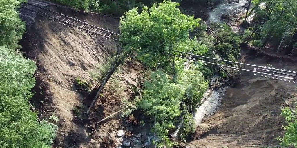 Drone Footage Reveals Railroad Tracks Suspended In Air After Vermont   Yt5scomFlood Cleanup And Railroad Trestle Destructionmp4 