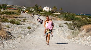 Greece wildfires force thousands to flee Rhodes as hundreds of firefighters rush to extinguish flames