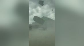 Watch: Tornado traps couple in car on Florida beach