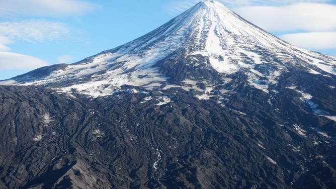 2022 File photo: Shishaldin Volcano viewed from the north. Lava flows from the 2019 eruption are visible in the center of the image.