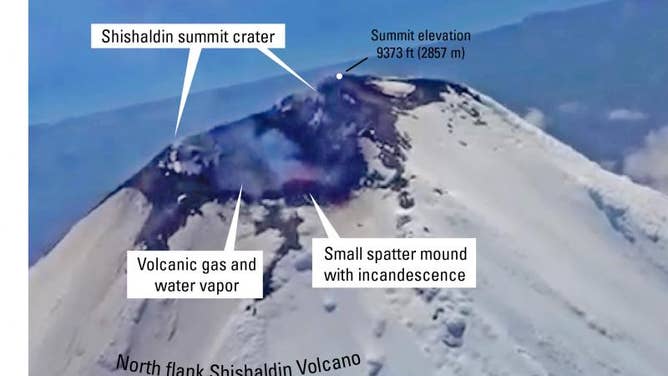 An annotated still from a video captured by Ian Erickson of the U.S. Coast Guard of eruptive activity at Shishaldin Volcano on July 12, 2023.
