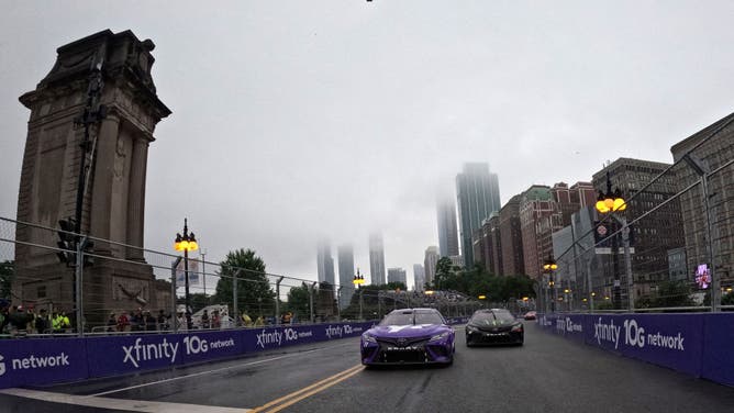 Denny Hamlin, driver of the #11 Yahoo! Toyota, leads the field at the start of the NASCAR Cup Series Grant Park 220 at the Chicago Street Course on July 02, 2023 in Chicago, Illinois.