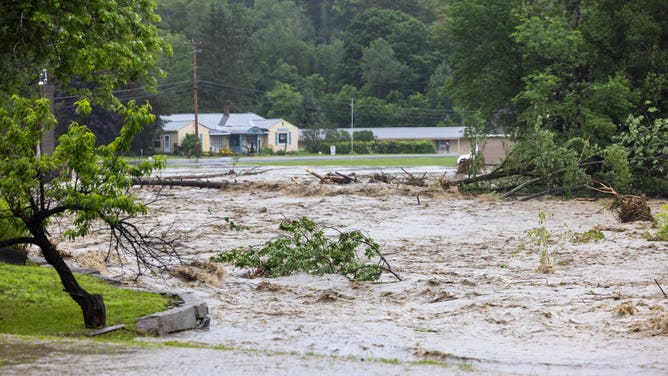 WINDHAM, VERMONT: Water floods around homes as the river overflows along Route 11 on July 10, 2023 in Windham, Vermont. (Photo by Scott Eisen/Getty Images)