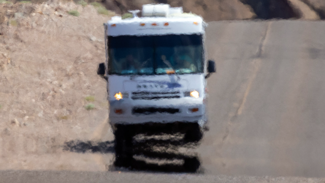 An RV shimmers in the heat haze as the temperature rises past about 127 degrees Fahrenheit on a day that could set a new world heat record in Death Valley National Park on July 16, 2023 near Furnace Creek, California.