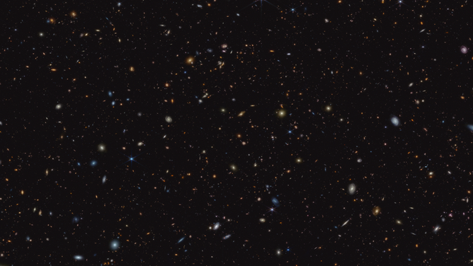 This infrared image from NASA’s James Webb Space Telescope (JWST) was taken for the JWST Advanced Deep Extragalactic Survey, or JADES, program. It shows a portion of an area of the sky known as GOODS-South, which has been well studied by the Hubble Space Telescope and other observatories. More than 45,000 galaxies are visible here.